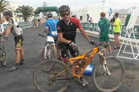 Scott by the finish line posing for a photo